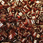 Toho Triangles - 11/0 - Gold Lustrered Red